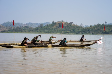 Dak Lak , Vietnam - March 12, 2017 : Traditional dug-out canoe racing festival on the Lak lake in Dak Lak, center highland of Vietnamのeditorial素材