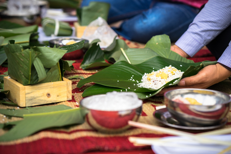 Making Chung cake by hands closeup, Chung cake is the most important traditional Vietnamese lunar New Year (Tet) food.の写真素材