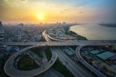 Hanoi, Vietnam - June 5, 2017: Aerial view of Hanoi cityscape by twilight period, with road junction and interchange overpass Vinh Tuy bridge - Minh Khai street - Nguyen Khoai streetのeditorial素材
