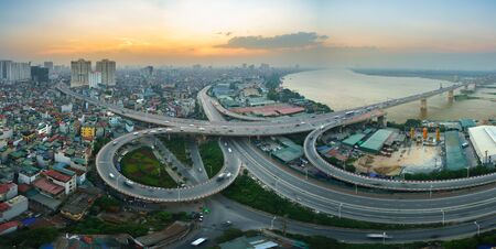 Hanoi, Vietnam - June 5, 2017: Aerial view of Hanoi cityscape by twilight period, with road junction and interchange overpass Vinh Tuy bridge - Minh Khai street - Nguyen Khoai streetのeditorial素材