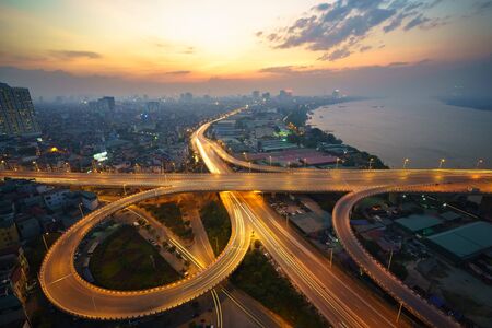 Hanoi, Vietnam - June 5, 2017: Aerial view of Hanoi cityscape by twilight period, with road junction and interchange overpass Vinh Tuy bridge - Minh Khai street - Nguyen Khoai streetのeditorial素材