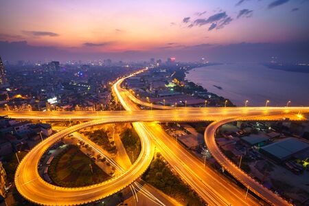 Hanoi, Vietnam - June 5, 2017: Aerial view of Hanoi cityscape by twilight period, with road junction and interchange overpass Vinh Tuy bridge - Minh Khai street - Nguyen Khoai streetのeditorial素材