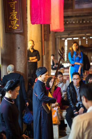Hanoi, Vietnam - Jun 22, 2017: Band of Traditional folk singers in communal house at So village, Quoc Oai district.のeditorial素材