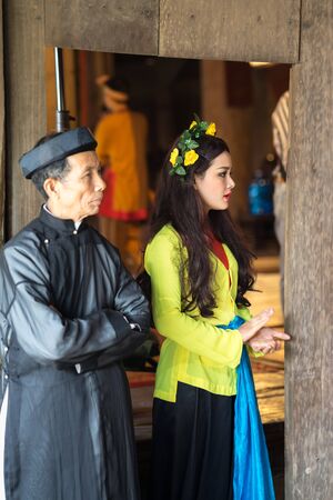Hanoi, Vietnam - Jun 22, 2017: Vietnamese girls with traditional pajamas at folk village festival in communal house at So village, Quoc Oai district.のeditorial素材
