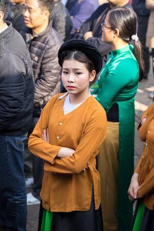 Hanoi, Vietnam - Jun 22, 2017: Vietnamese girls with traditional pajamas at folk village festival in communal house at So village, Quoc Oai district.のeditorial素材