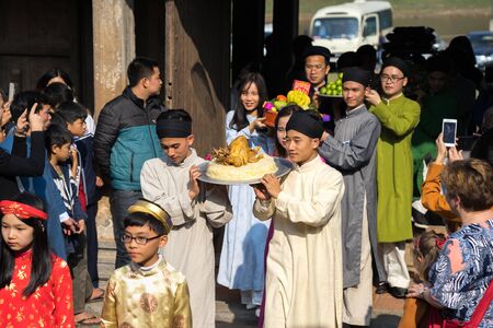 Hanoi, Vietnam - Jun 22, 2017: Traditional incense offering ritual during lunar new year Tet holiday in communal house at So village, Quoc Oai district.のeditorial素材