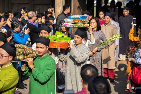 Hanoi, Vietnam - Jun 22, 2017: Traditional incense offering ritual during lunar new year Tet holiday in communal house at So village, Quoc Oai district.のeditorial素材