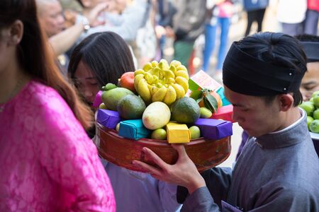 Hanoi, Vietnam - Jun 22, 2017: Traditional incense offering ritual during lunar new year Tet holiday in communal house at So village, Quoc Oai district.のeditorial素材
