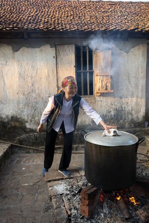 Hanoi, Vietnam - Jun 22, 2017: Cooking Chung cake outdoor in communal house at So village, Quoc Oai district. , square glutinous rice cake, Vietnamese lunar new year foodのeditorial素材