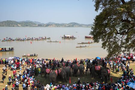 Dak Lak , Vietnam - March 12, 2017 : Traditional dug-out canoe and elephant racing festival on the Lak lake in Dak Lak, center highland of Vietnamのeditorial素材