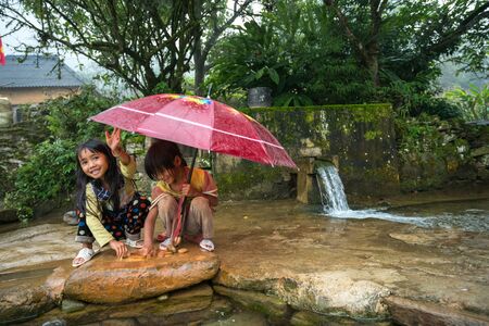Lao Cai, Vietnam - Sep 7, 2017: Ethnic minority children playing at small spring in Y Ty, Bat Xat districtのeditorial素材