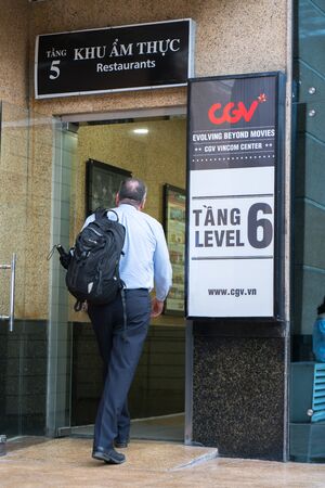 Hanoi, Vietnam - July 7, 2017: GV Cinemas sign at Vincom center Ba Trieu building, with people walking into the buildingのeditorial素材