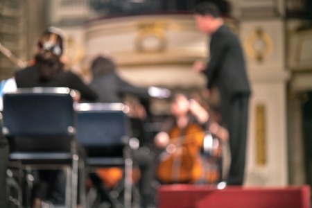 Blurred Artists symphony orchestra. Musician plays a musical instrument on the concert stage.の写真素材