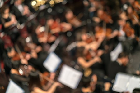 Blurred Artists symphony orchestra. Musician plays a musical instrument on the concert stage.の写真素材