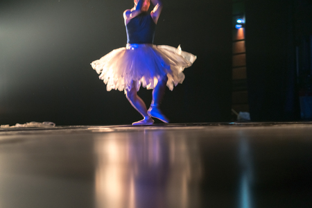 Blurred legs of ballet dancer on stage in theaterの写真素材