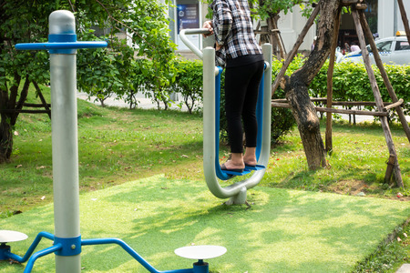 Outdoors public excercise machine in a public park.