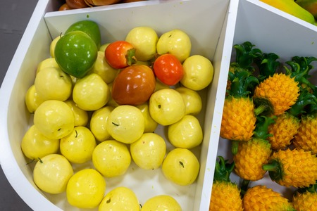 Plastic fruits on model supermarket shelf. Children pay toysの写真素材