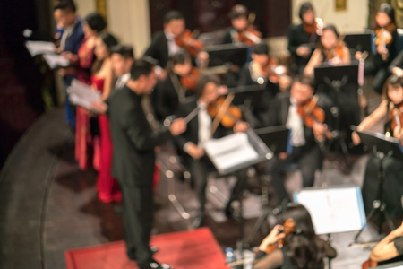 Blurred Artists symphony orchestra. Musician plays a musical instrument on the concert stage.の写真素材