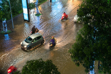 Top view of flooded traffic in a heavy rain in Hanoi, Vietnamの写真素材