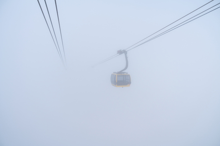 The cable car to mountain top with mistの写真素材