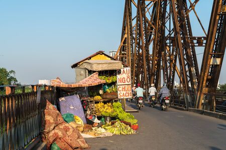 Hanoi, Vietnam - Oct 31, 2018: Street fruit vendor stall on Long Bien old bridgeのeditorial素材