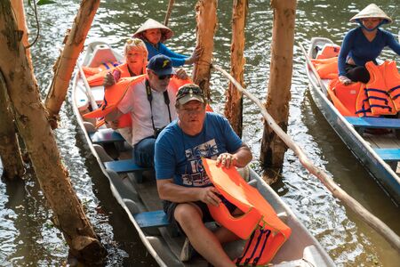 Chau Doc, Vietnam - Oct 13, 2018: Closeup tourism rowing boat in cajuput forest in floating water season in Mekong delta, Vietnamのeditorial素材