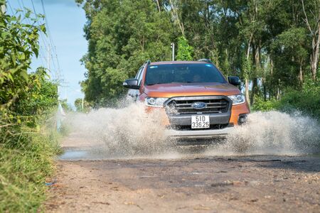 Chau Doc, Vietnam - Oct 13, 2018: All new Ford Everest 2018 car on the rural road in test drive,...