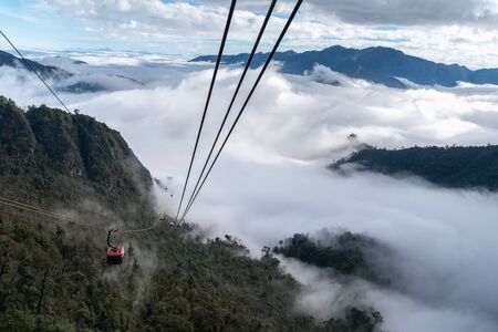 Lao Cai, Vietnam - Jan 3, 2019: The cable car to Fansipan mountain top with low clouds and mountain view in Sapa townのeditorial素材