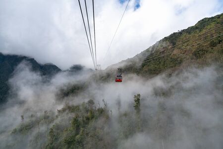 Lao Cai, Vietnam - Jan 3, 2019: The cable car to Fansipan mountain top with low clouds and mountain view in Sapa townのeditorial素材