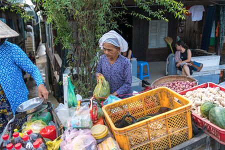 Chau Doc, Vietnam - Oct 13, 2018: Local market stall selling vegetables on side of road in the Mekong Delta, Vietnamのeditorial素材