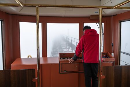 Lao Cai, Vietnam - Jan 3, 2019: Driver in tourism mountain train in SAPA go to the station and peak of Fansipan mountainのeditorial素材