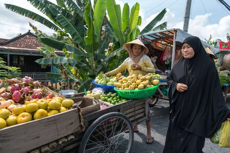 Chau Doc, Vietnam - Oct 13, 2018: Local market stall selling vegetables on side of road in the Mekong Delta, Vietnamのeditorial素材