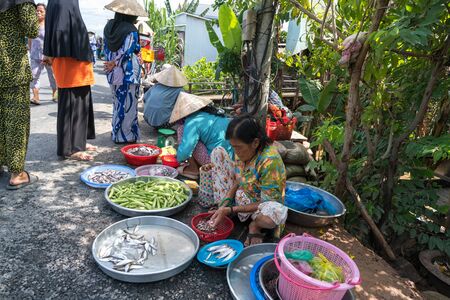 Chau Doc, Vietnam - Oct 13, 2018: Local market stall selling vegetables on side of road in the Mekong Delta, Vietnamのeditorial素材