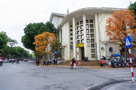 Hanoi, Vietnam - Feb 13, 2019: Hanoi street in fall season with yellow red leaves on branches. The "leaf change" seasonのeditorial素材