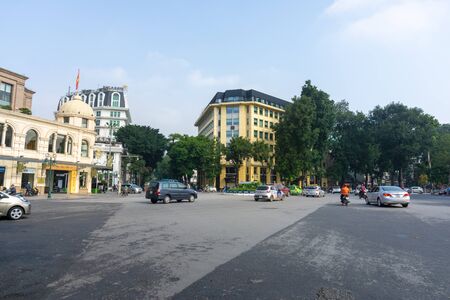 Hanoi, Vietnam - Feb 18, 2019: Hanoi street at August Revolution Square, with very few vehicles, and old buildings on backgroundのeditorial素材