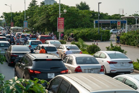 Cars on urban street in traffic jam at rush hour in big city