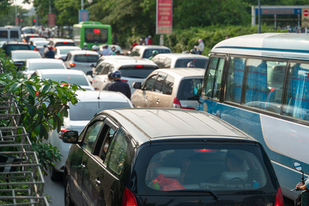 Cars on urban street in traffic jam at rush hour in big cityのeditorial素材