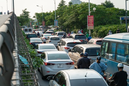 Cars on urban street in traffic jam at rush hour in big cityのeditorial素材