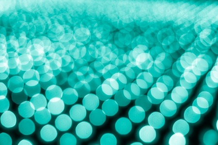 Abstract bokeh background. Soft defocused lights. Neon basic cyan color
