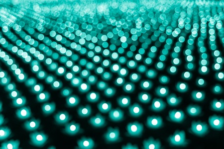 Abstract bokeh background. Soft defocused lights. Neon basic cyan colorの写真素材