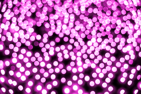 Abstract bokeh background. Soft defocused lights. Neon basic pink colorの写真素材