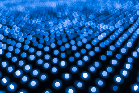 Abstract bokeh background. Soft defocused lights. Neon basic blue colorの写真素材
