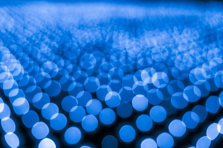 Abstract bokeh background. Soft defocused lights. Neon basic blue colorの写真素材