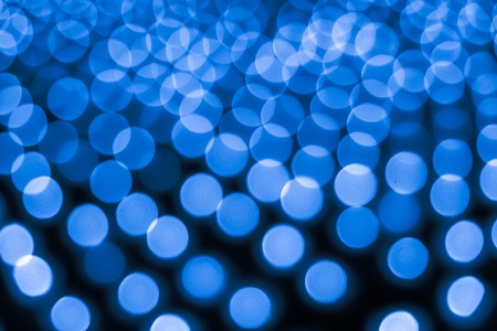Abstract bokeh background. Soft defocused lights. Neon basic blue colorの写真素材