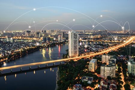 Smart city and wireless communication network concept. Digital network connection lines of Hanoi city, Vietnam at Linh Dam peninsula, Hoang Mai districtの写真素材