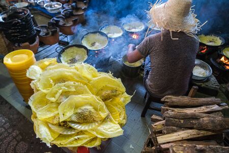 Banh xeo, Vietnamese traditional street food yellow crispy rice flour cake. Sizzling cake, named for the loud sizzling sound it makes when the rice batter is poured into the hot skilletの写真素材