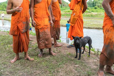 Dirty dress of novice monks after working on rice field in Chau Doc, Mekong delta, Vietnamの写真素材