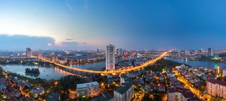 Aerial skyline view of Hanoi at Linh Dam lake, Belt Road No. 3. Hanoi cityscape by sunset periodの写真素材