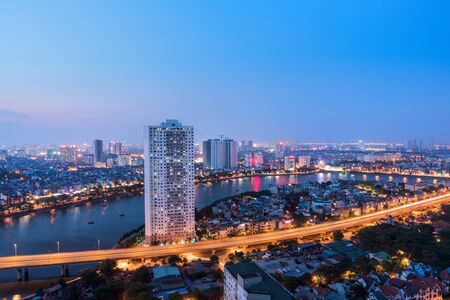 Aerial skyline view of Hanoi at Linh Dam lake, Belt Road No. 3. Hanoi cityscape by sunset periodの写真素材