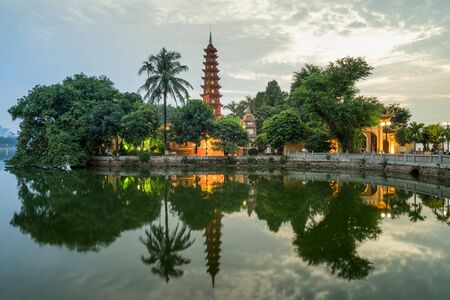 Tran Quoc pagoda during sunset time, the oldest temple in Hanoi, Vietnam. Hanoi cityscape.の写真素材